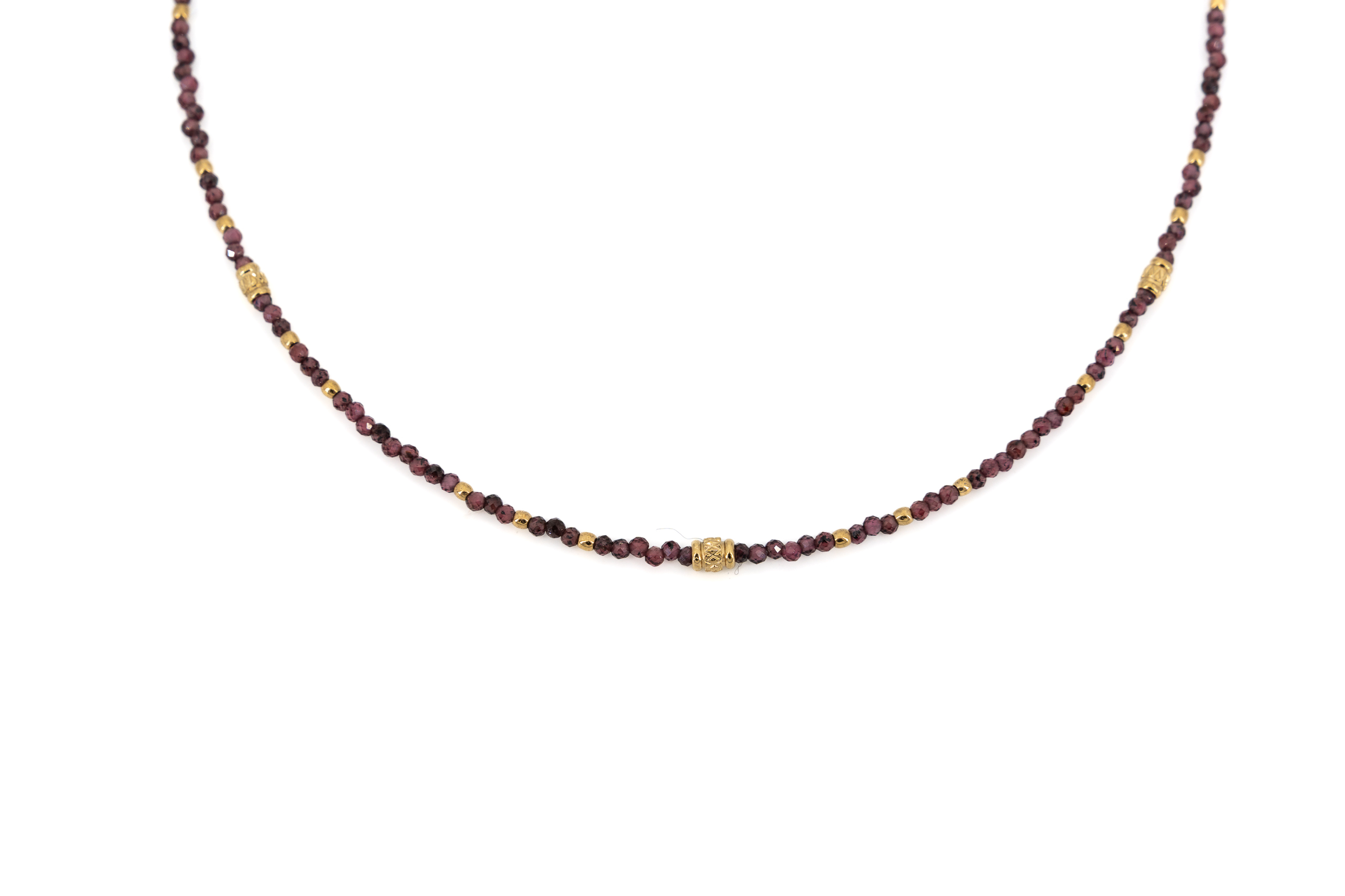 Collana corta acciaio dorato con pietrine viola e tubini